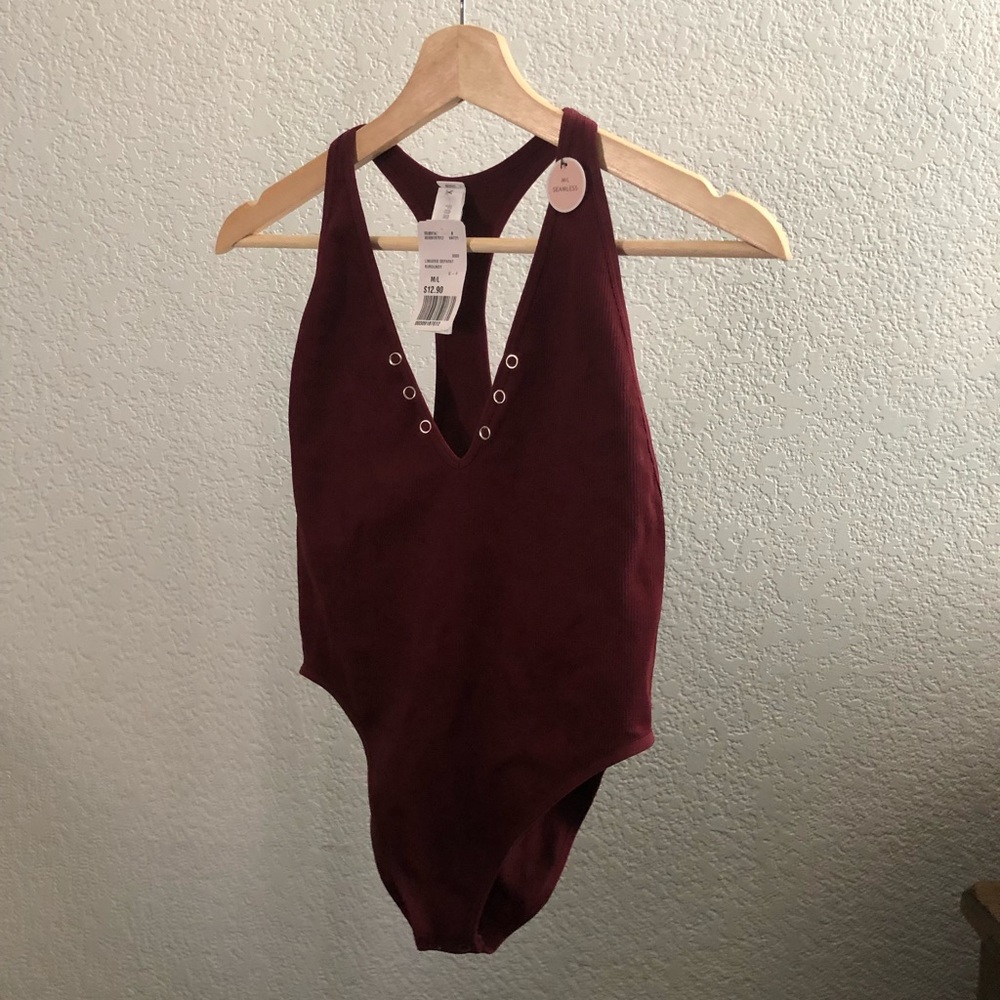 A brand new burgundy bodysuit with tag!